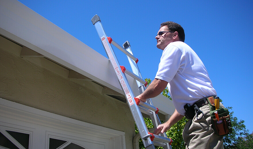 Roof inspector on a ladder service-02